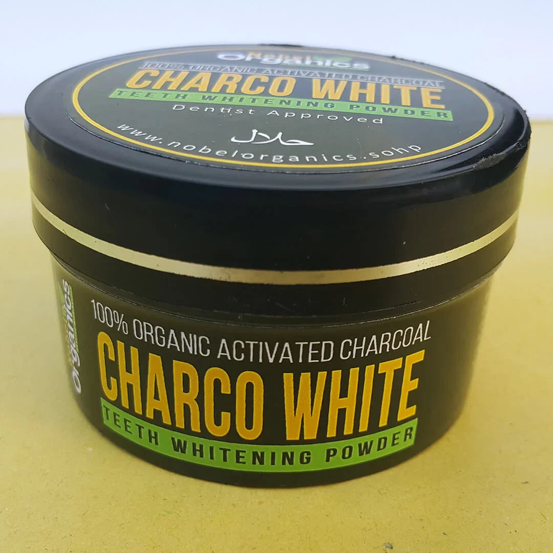Jar of Charco White teeth whitening powder with black lid on a yellow background