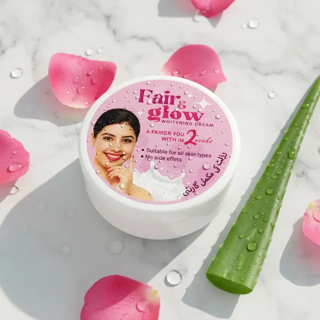 Fair & Glow whitening cream jar with pink petals and aloe vera on a light background